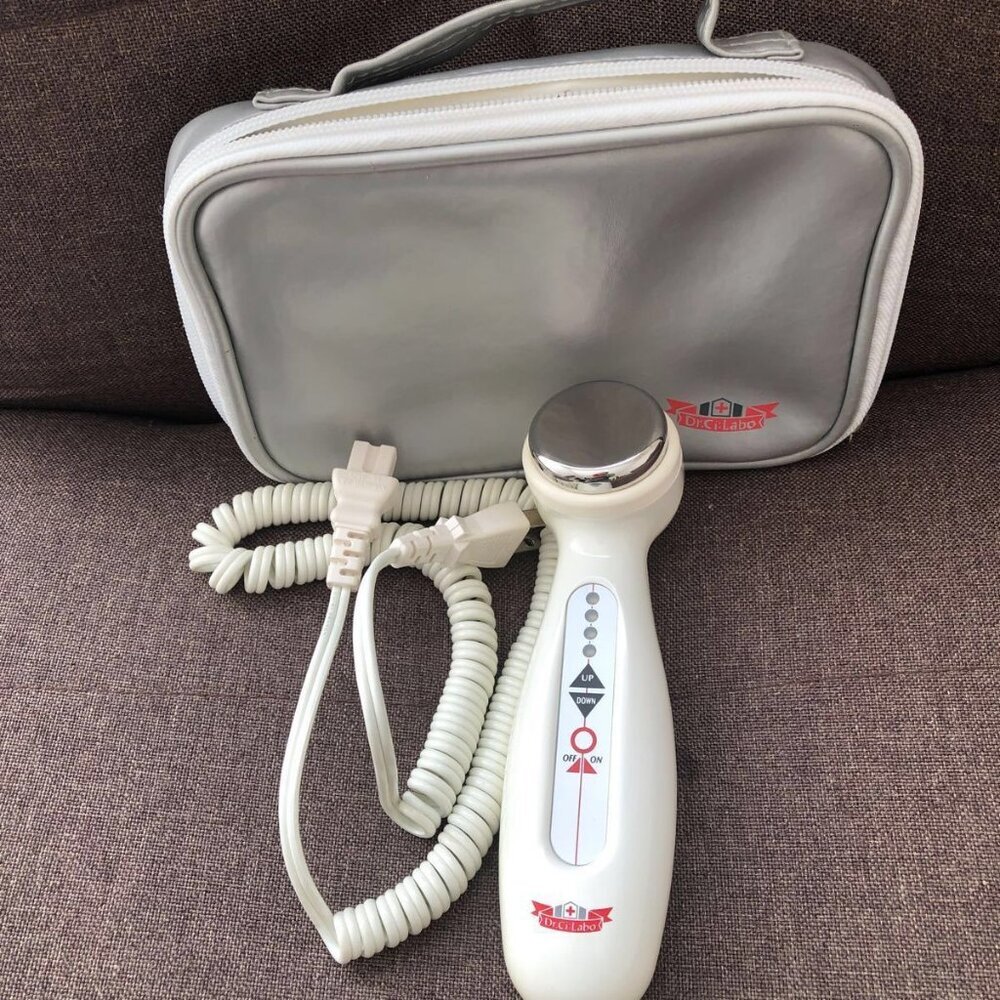 White Skincare Tool with Silver Accents